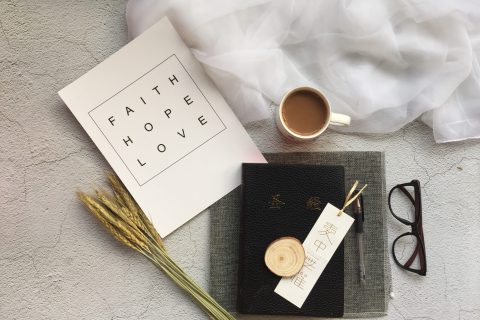 white ceramic mug near black-framed eyeglasses