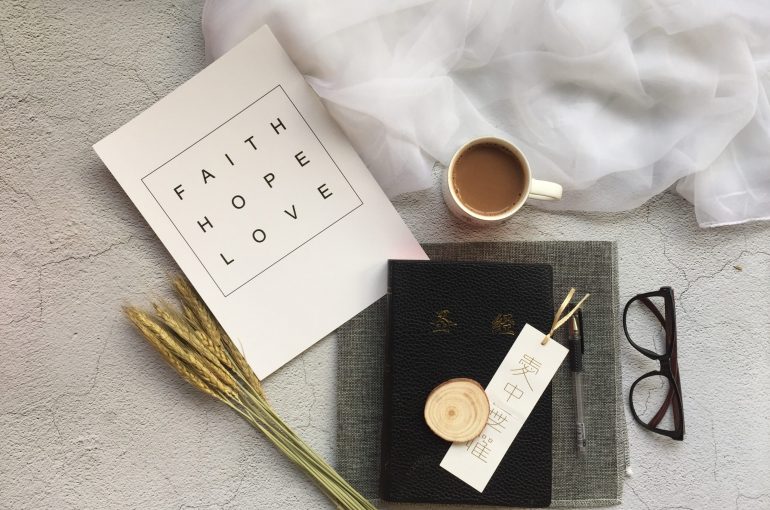 white ceramic mug near black-framed eyeglasses