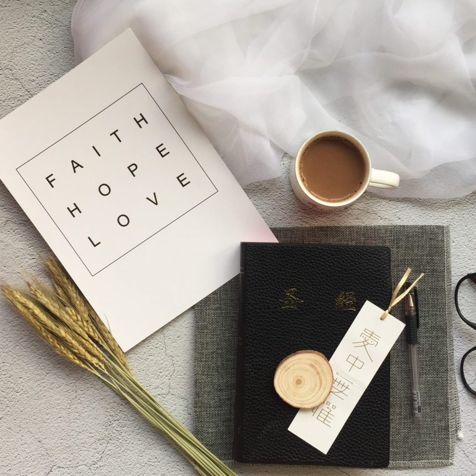white ceramic mug near black-framed eyeglasses